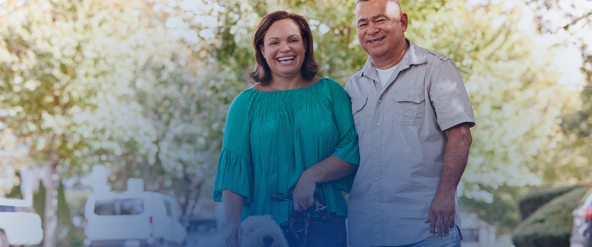 Woman and man smiling outside